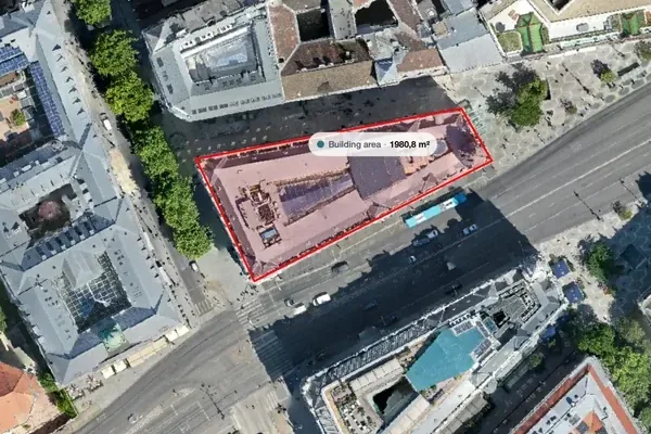Orthomosaic of a city block in the MapperTool viewer, with a building area measured at 1980.8 square metres and a named pin point