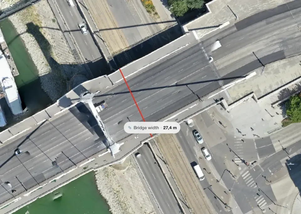 Distance measurement line drawn across a bridge on a zoomed-in orthomosaic, close enough to see individual pixels