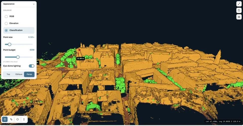 Point cloud coloured by classification, buildings in orange and vegetation in green, viewed from an angle