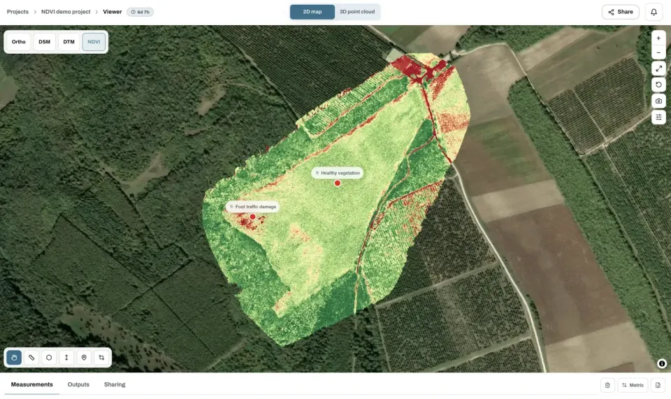 Vegetation index map of a field in the viewer, with a healthy vegetation point and a foot traffic damage point marked